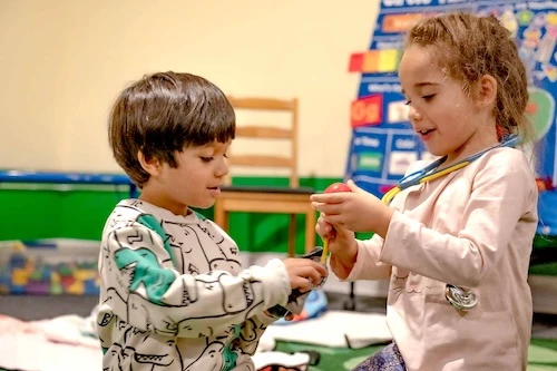 Two Children Interacting at Play Pals Inclusion Preschool in San Leandro