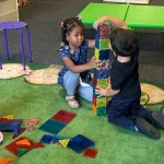 Children building tower together at East Bay, California preschool