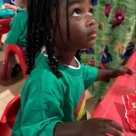 Preschooler engaged in classroom learning at San Leandro, California preschool