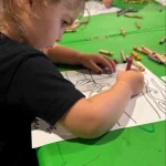 Toddler coloring activity at San Leandro, California preschool