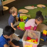Toddlers playing with building blocks at San Leandro, California preschool